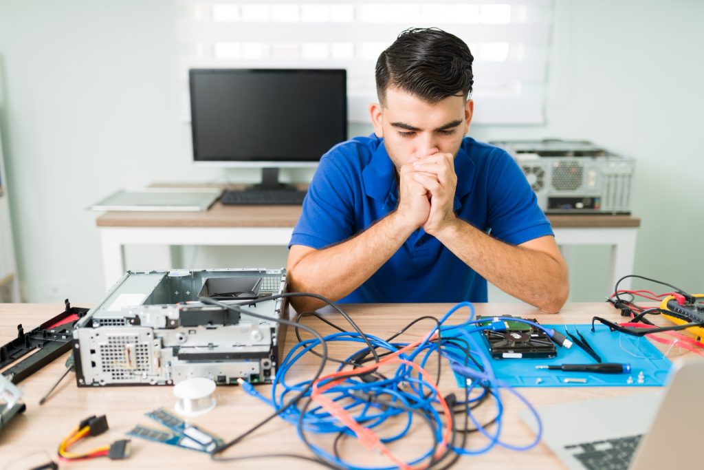 i know what worried technician feeling confused while looking cables computer thinking how fix it