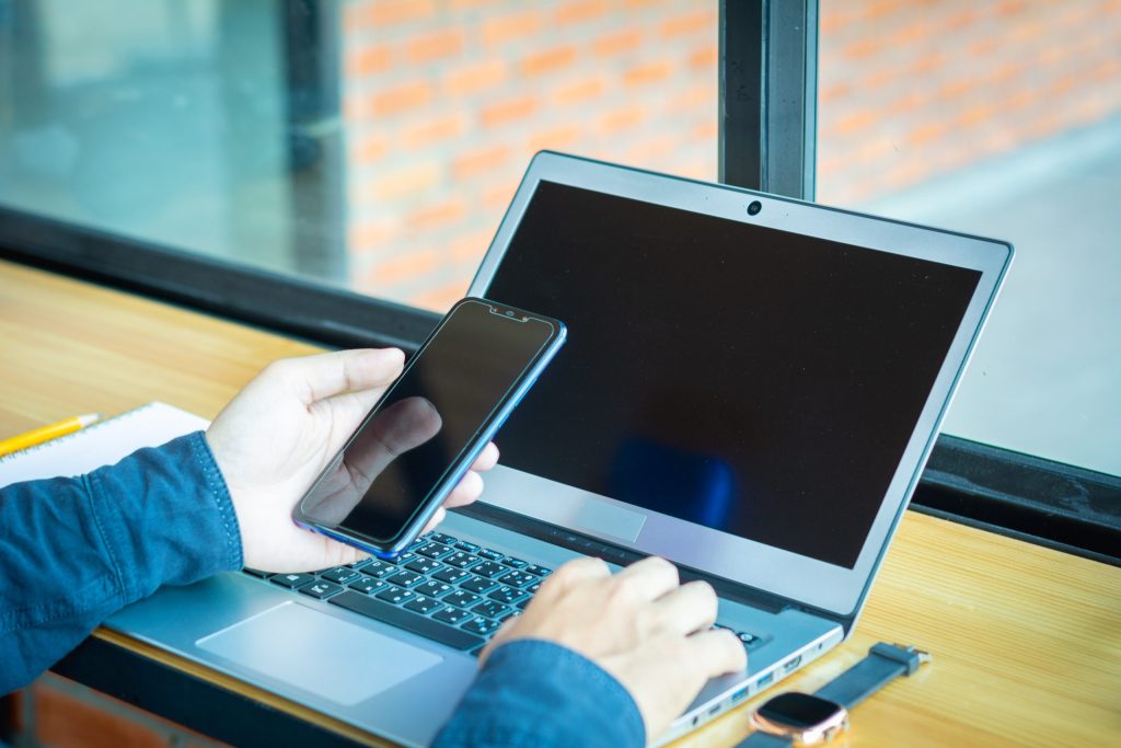 low section person using mobile phone table