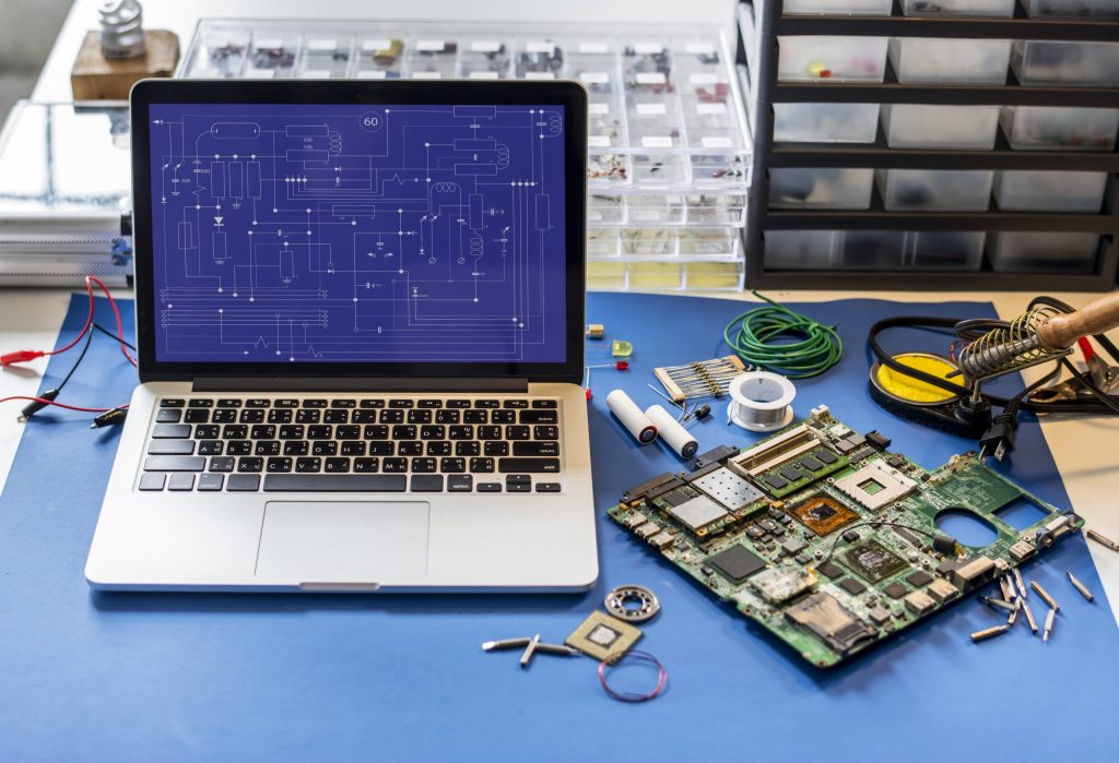 computer laptop showing electronic circuit pattern
