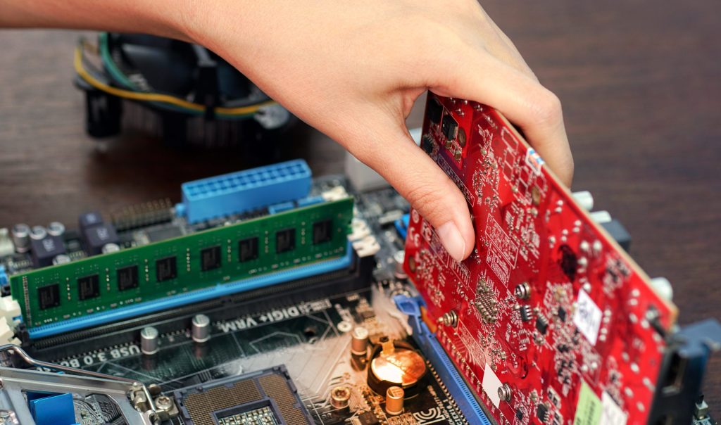 high angle view person holding computer chip table