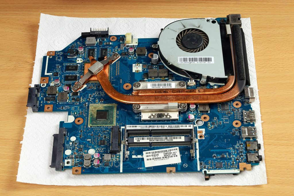 laptop repair motherboard with processor cooling system table