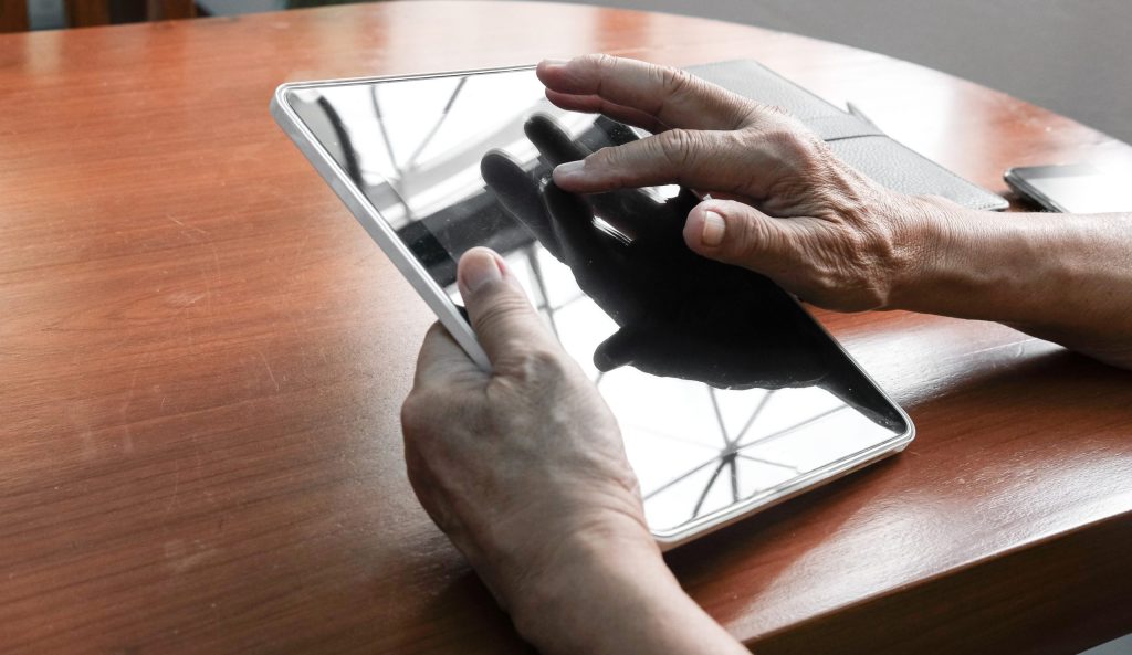 midsection woman using digital tablet table